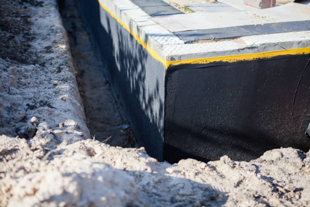 Professional Basement Waterproofing technician working in Houghton, NY
